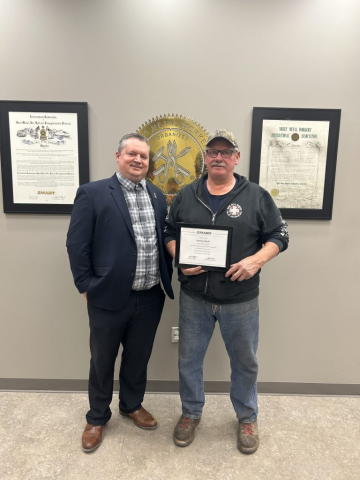 TJ King presenting Anthony Knoll with his 25-year continuous service award.